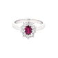 Oval Ruby and round brilliant cut diamond cluster style ring