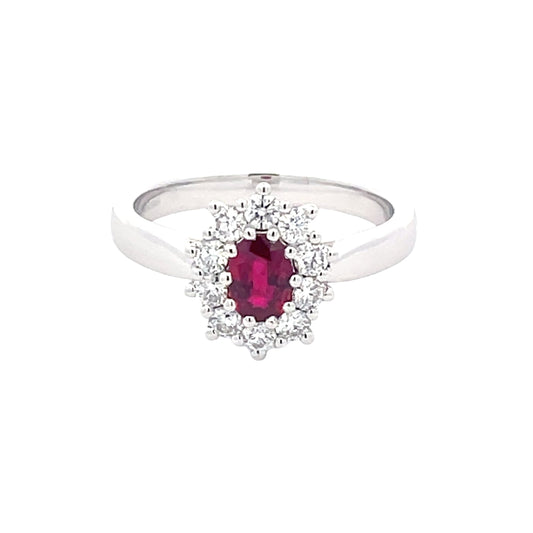 Oval Ruby and round brilliant cut diamond cluster style ring