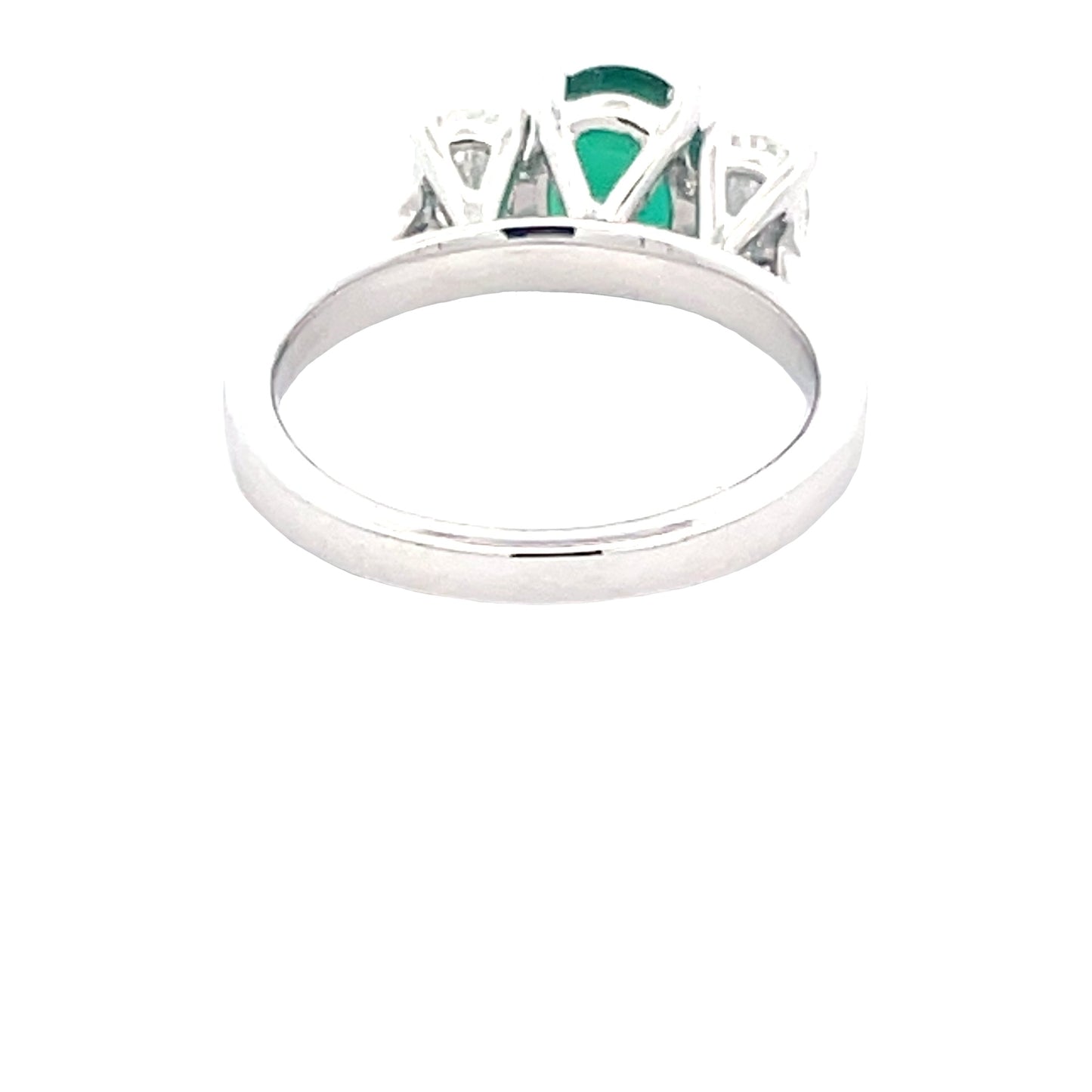 Oval Shaped emerald and oval diamond 3 stone ring