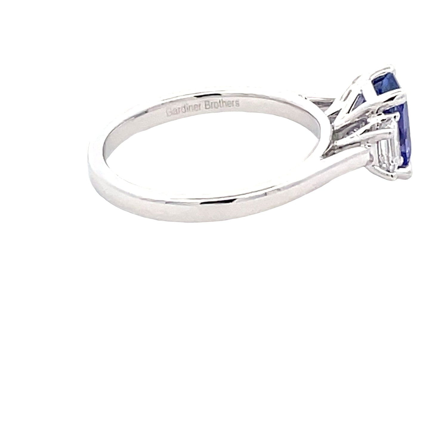 Octagonal Shaped Tanzanite and emerald cut diamond 3 stone ring