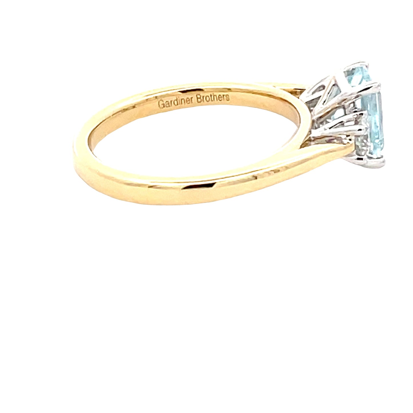 Octagonal Aquamarine and round brilliant cut diamond 3 stone ring