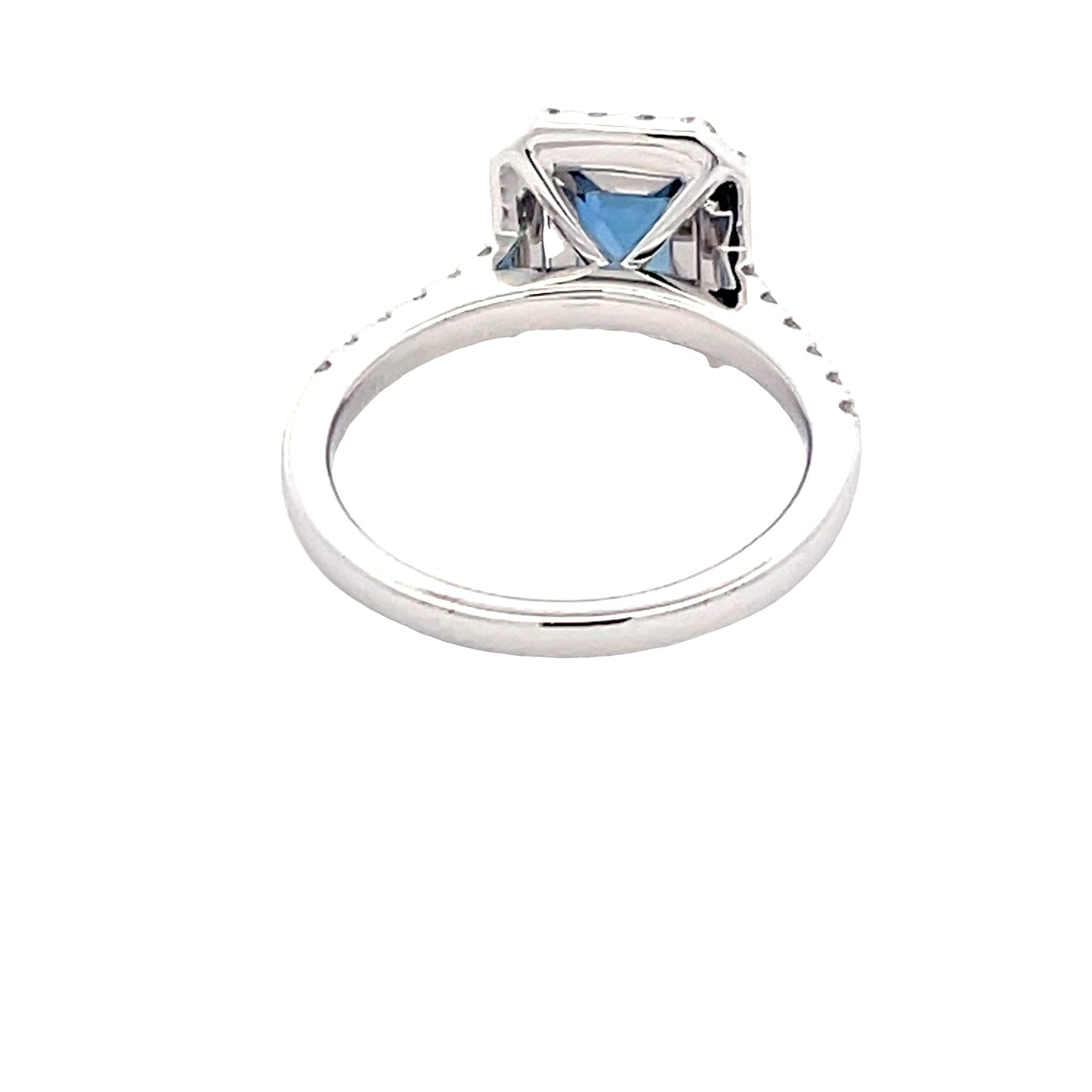 Octagonal Sapphire and round brilliant cut diamond halo cluster style ring