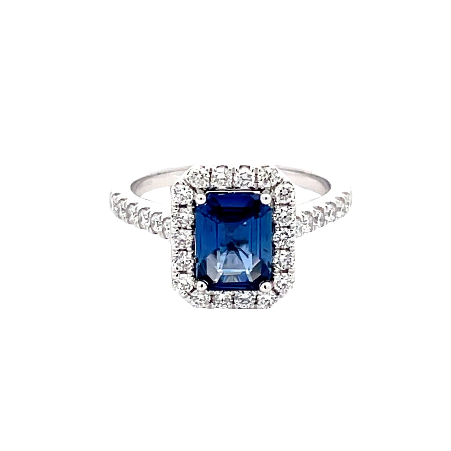 Octagonal Sapphire and round brilliant cut diamond halo cluster style ring