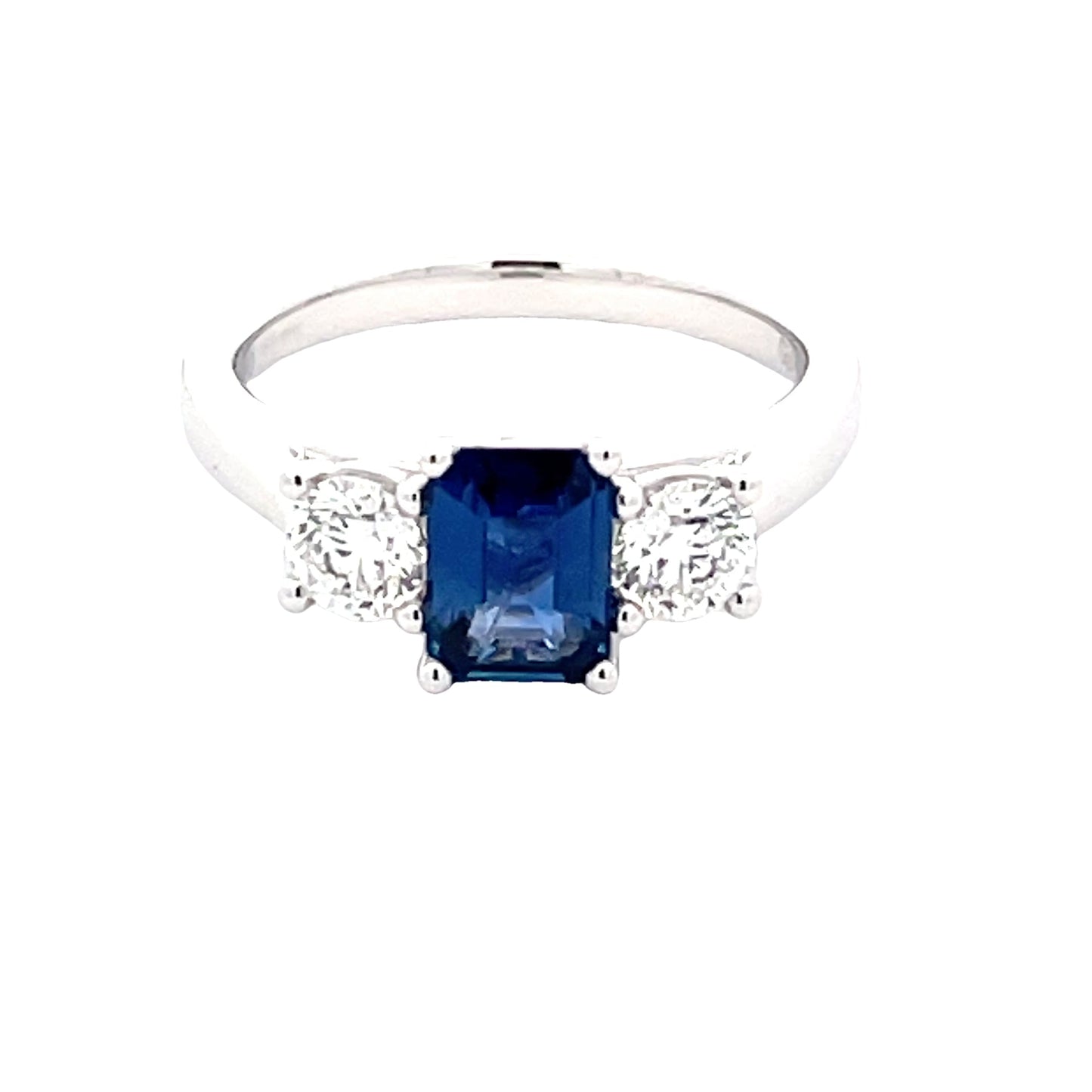 Octagonal Sapphire and round brilliant cut diamond 3 stone ring