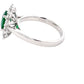 Oval Emerald and Round brilliant cut diamond cluster ring