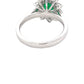 Oval Emerald and Round brilliant cut diamond cluster ring