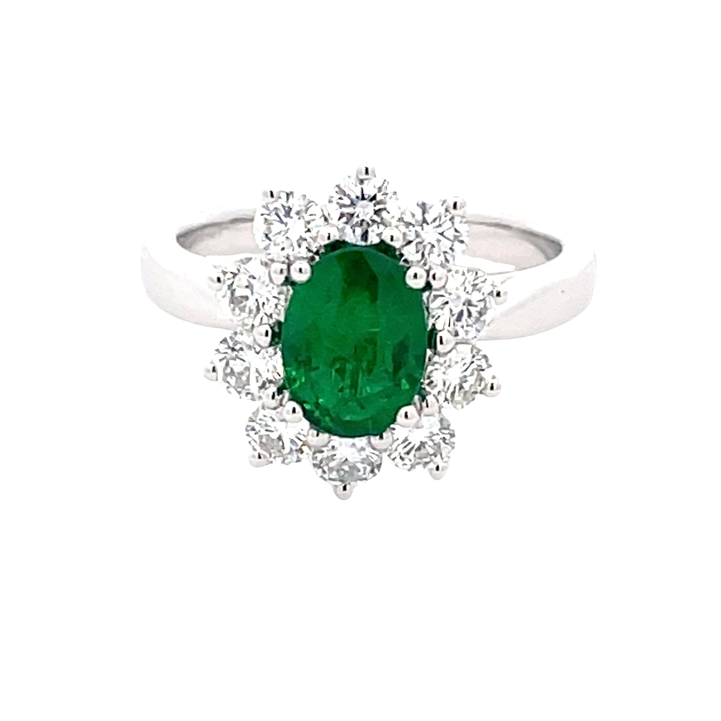 Oval Emerald and Round brilliant cut diamond cluster ring