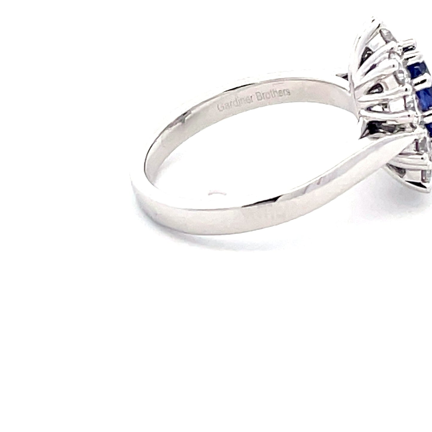 Oval Tanzanite and Round Brilliant Cut Diamond Cluster Ring